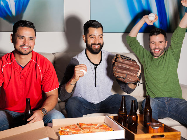 Three guys watching baseball and enjoying beers while playing the Baseball Drinking Game