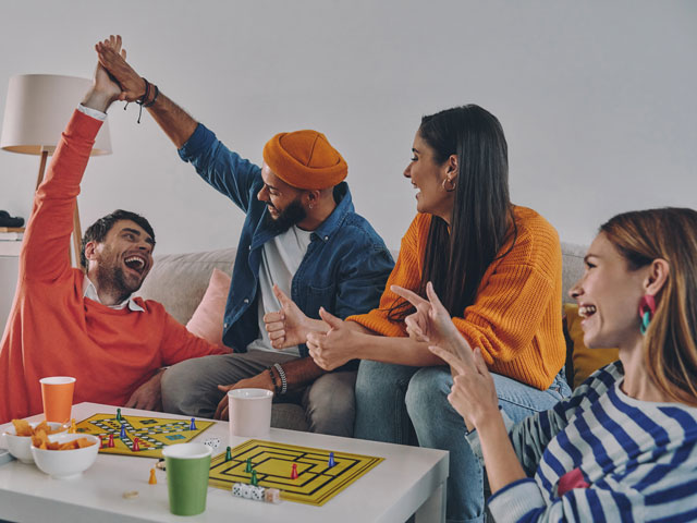 A group of friends playing games at a college dorm party