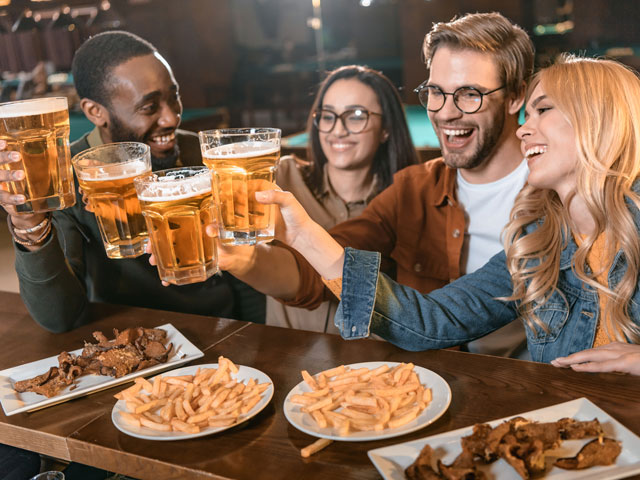 Bar Crawlers eating food at one of the check-in points of the crawl