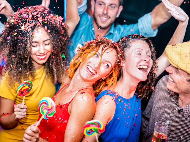 Bar Crawlers kicking off a Pub Crawl with drinks and confetti