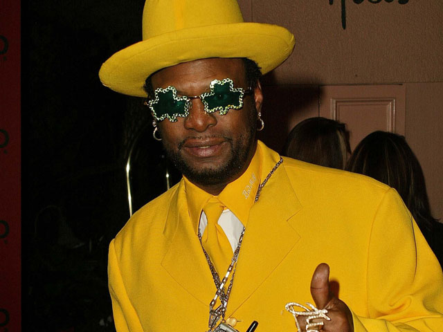 Archbishop Don Magic Juan in full yellow pimp suit